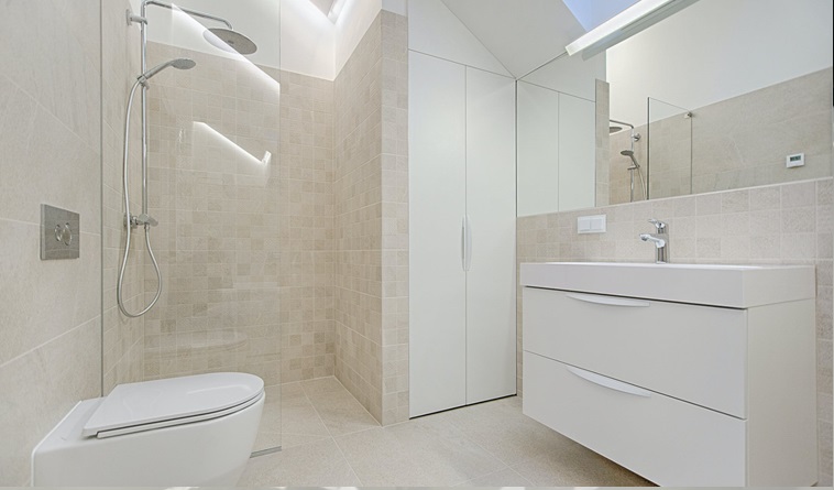 bathroom with vanity and shower